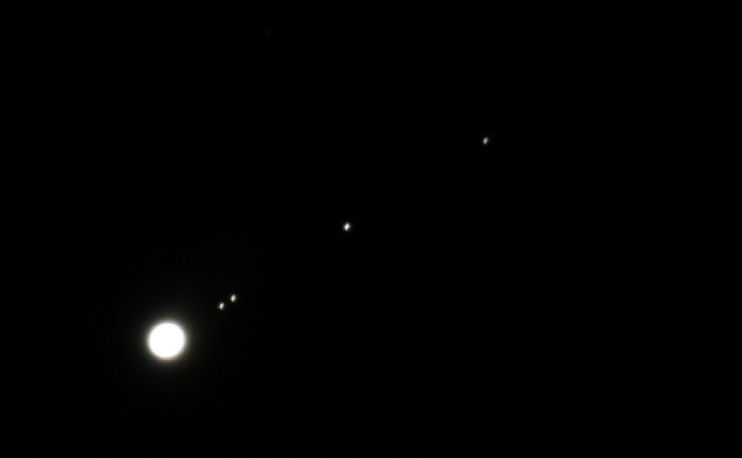 Jupiter  By T Hayes. 18th March 20.15 UT with (left to right) Europa, Io, Ganymede and Callisto.  Canon EOS 1200d through my Celestron 6SE, without any auto guiding.  Four seconds at ISO-800. Cropped and resized in PSP from the original picture. I realise that this is not a particularly good photograph But I was pleased to get all four Galilean moons  in a nice line.